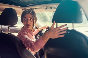 girl backing up vehicle