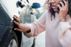 driver checking car after no-contact car accident