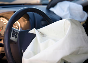 a deployed car airbag after an accident