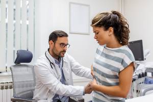 doctor examining abdominal pain