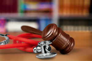 gavel laying on stethoscope