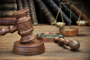 law office with gavel and scale and law books