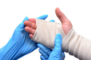 a hand being bandaged