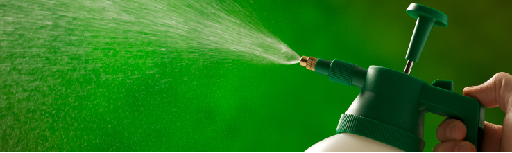 farmer spraying paraquat pesticide 