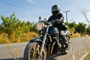 motorcyclist traveling on country road 