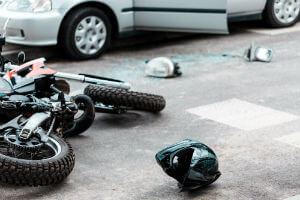 motorcycle turned over in front of vehicle