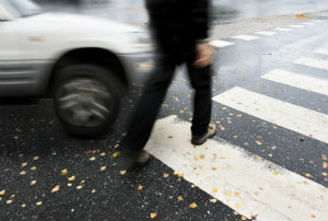 pedestrian walking by car