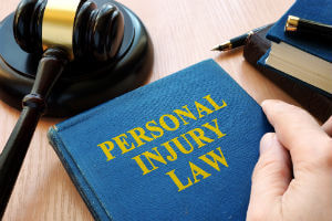 personal injury law book and gavel