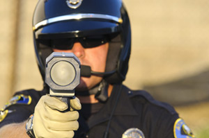 police officer holding a radar gun