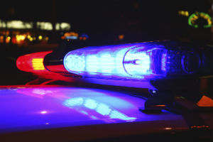 police car with lights at night