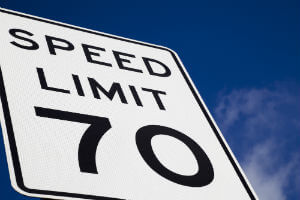 speed limit sign under blue sky