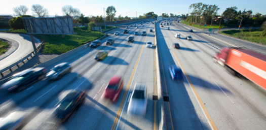 autos driving on busy highway