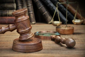 law office with gavel and scale and law books