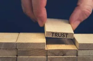 pile of blocks with trust on one of them