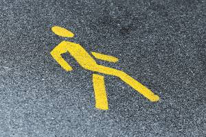 pedestrian sign painted on road